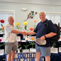 Southtown Dahlia Club, Chicago South Suburbs,  Heinz Pieniak (left) being congratulated by Jim Kassner (right)
